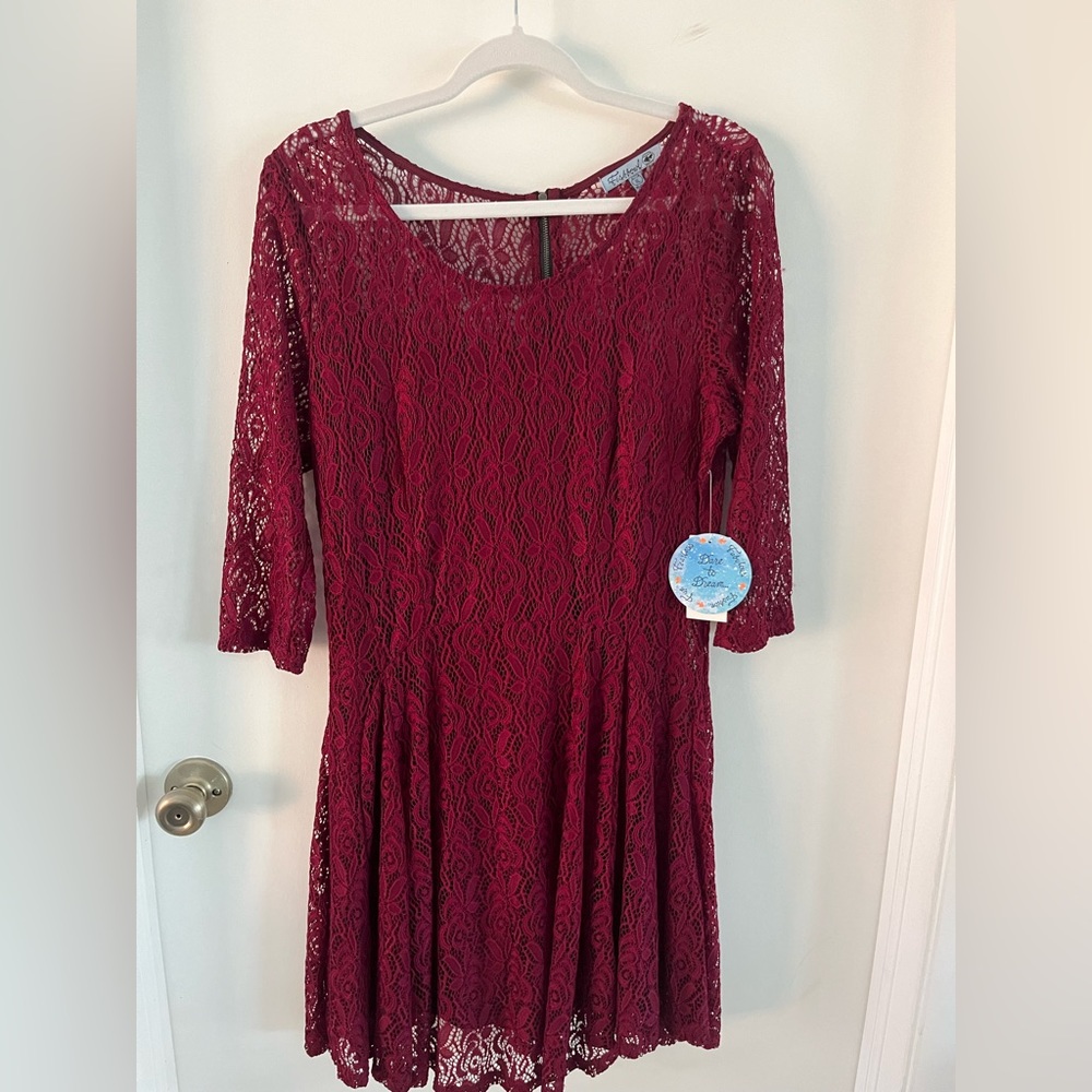Fishbowl XL burgundy mini dress with a black slip attached.